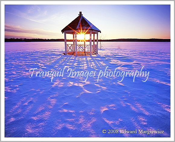 450498---A winters sunset sthrough a gazebo at Stoney Creek Park